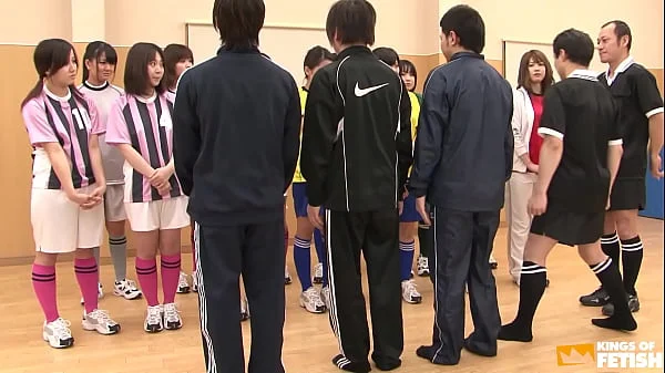 Japanese female team listen and take a lesson from their coach